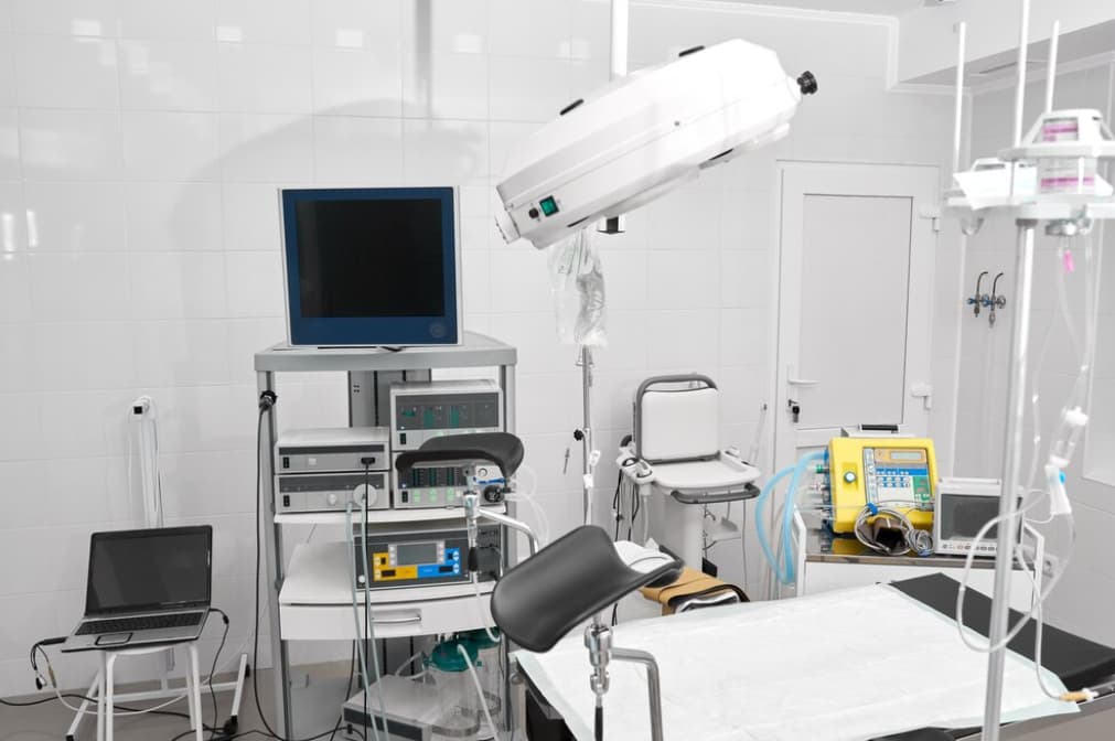 A modern and sterile medical room equipped with various medical devices